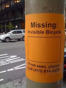 signpost saying "missing invisible bicycle"